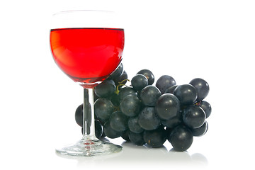 Image showing Red wine in glass with grape