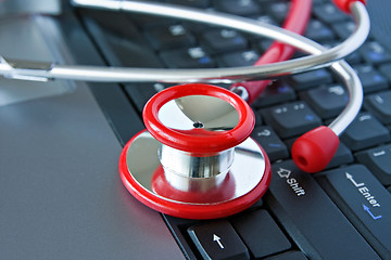 Image showing Stethoscope and computer