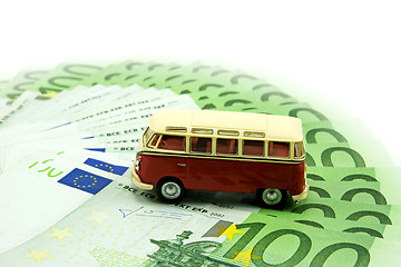 Image showing red car and money 