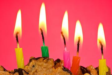 Image showing birthday candles against red background