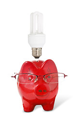 Image showing Piggy-bank with glasses and  light bulb