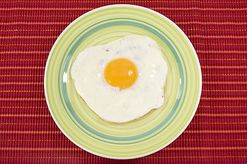 Image showing green plate with cooked egg