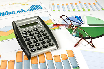 Image showing colorful  charts, calculator and glasses