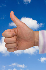 Image showing thumb up on sky background