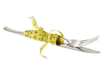 Image showing Fork and knife wrapped by measure tape