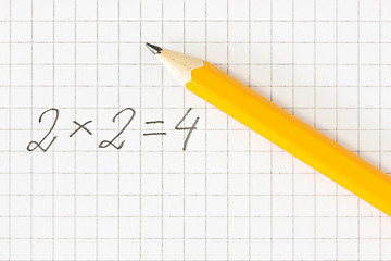 Image showing math formula and pencil on squared paper