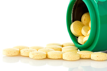 Image showing  pill bottle with yellow pills