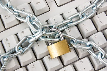 Image showing keyboard secured with chain and padlock