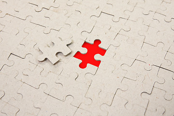 Image showing papper puzzle with  red piece missing