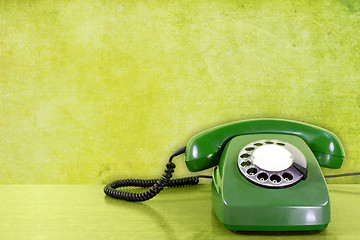 Image showing phone against green wall background