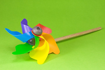 Image showing Colorful pinwheel over green