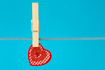 Image showing decorative heart hung on clothesline