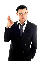 Image showing friendly businessman showing ok sign