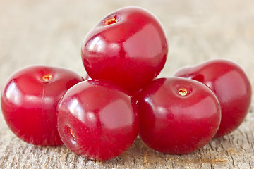 Image showing cherries  on the  wood