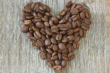 Image showing coffe beans heart on wood background