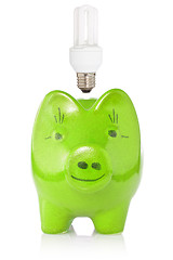 Image showing Green piggy-bank with lightbulb