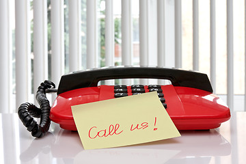 Image showing red office telephone