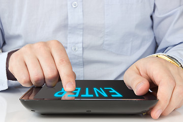 Image showing hand touching screen on digital tablet pc