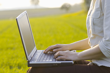 Image showing Working outside with laptop