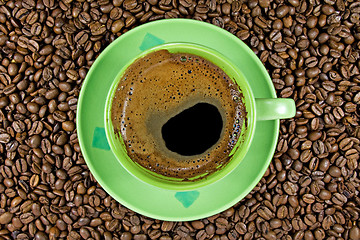 Image showing coffee beans and green cup