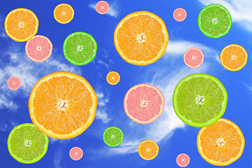 Image showing citrus fruits slices  falling in a sky