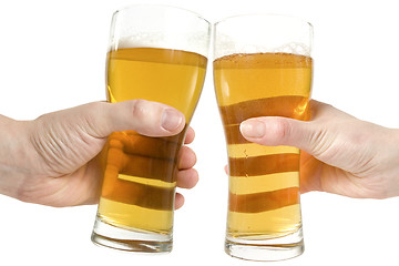 Image showing two hands holding beers making a toast 