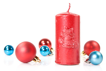 Image showing red   candle and christmas baubles