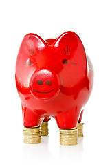 Image showing piggy bank standing on coins 