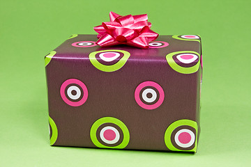 Image showing gift box on the green background 