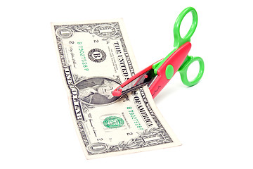 Image showing Scissors cuts one american dollar