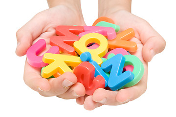 Image showing child hands with color alphabet