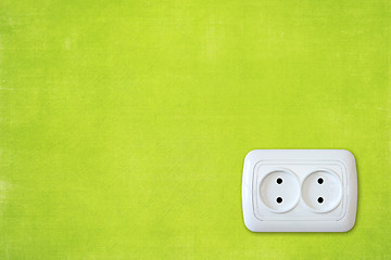 Image showing  green wall with white electric outlet