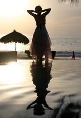 Image showing Woman watching sunset