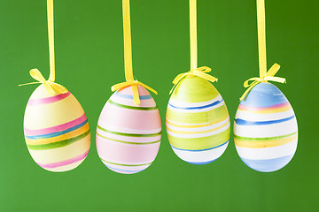 Image showing four hung easter eggs