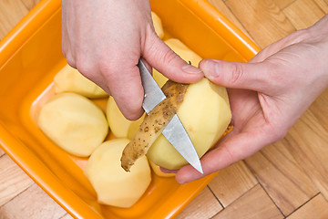 Image showing peeling potatoes