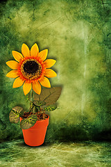 Image showing artificial sunflower on dark green background