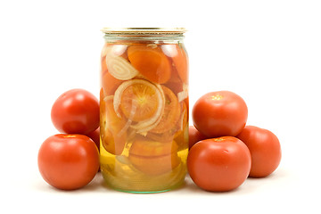 Image showing The clear glass jar of pickled tomatoes