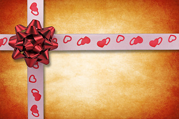 Image showing ribbon with bow on grunge background