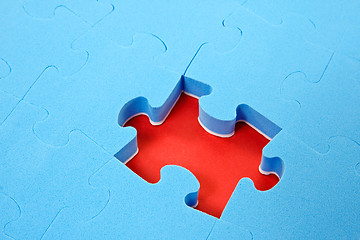 Image showing blue puzzle  with one piece missing