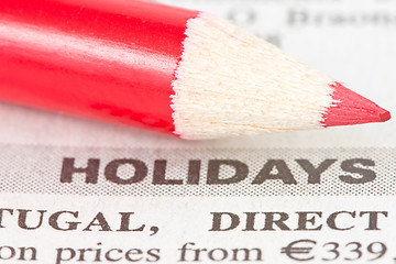 Image showing newspaper  with holidays ad