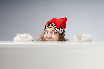 Image showing Afraid hidden Santa