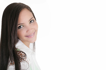 Image showing Cute Latina teenage girl smiling with braces on a white backgrou