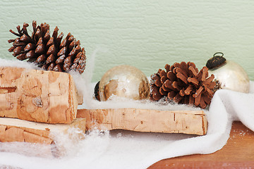 Image showing abstract composition from birch logs, Christmas balls and cones