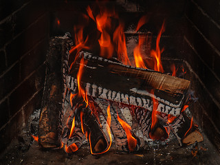 Image showing fireplace with wood and fire 