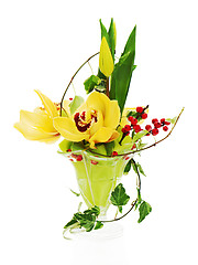 Image showing bouquet from orchids, tulips and ivy arrangement centerpiece in 