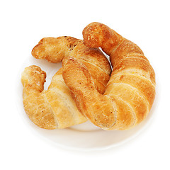 Image showing fresh and tasty croissant on plate isolated on white background