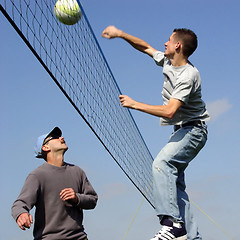 Image showing Couple men playing volleyball