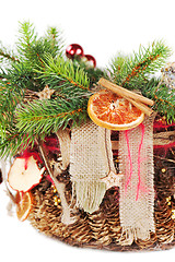 Image showing Christmas-tree branch decorated with balls, beads, cinnamon and 