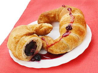 Image showing fresh and tasty croissants with chocolate and raspberry jam on p