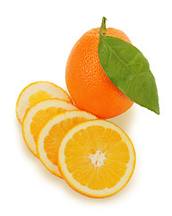 Image showing fresh ripe orange fruits with cut and green leaves isolated on w